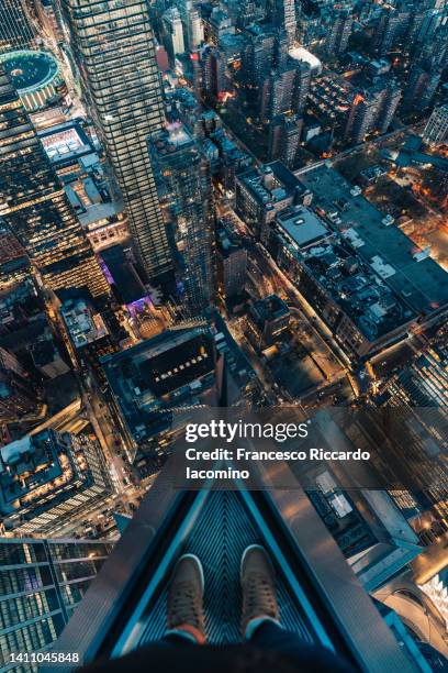 on the edge of a skyscraper, new york city - vertigo stock pictures, royalty-free photos & images