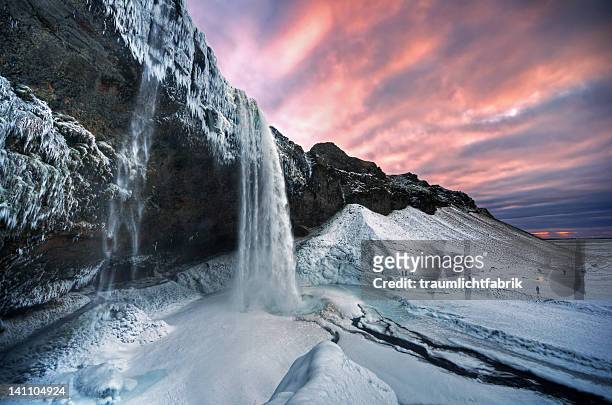 seljalandsfoss sunset - iceland waterfall stock-fotos und bilder