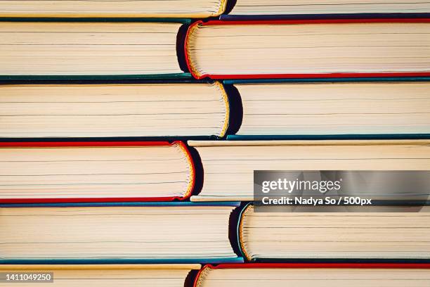 texture background of many hardcover paper books - hardbound stock pictures, royalty-free photos & images