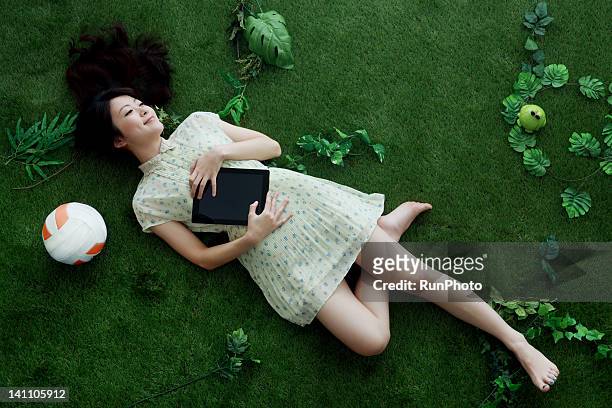 young woman on the green - woman dress grass stock pictures, royalty-free photos & images