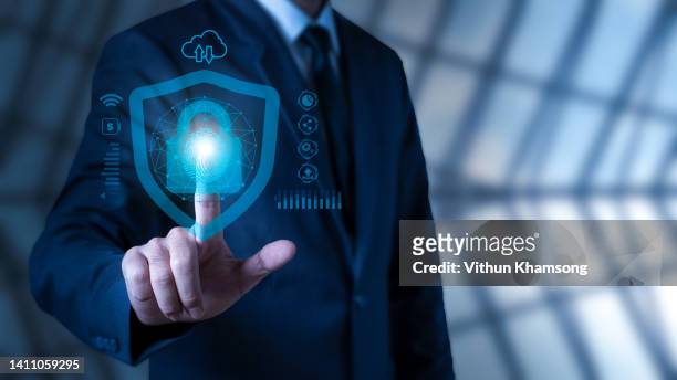 businessman using fingerprint scanning unlock and access to business data network - access control stock pictures, royalty-free photos & images