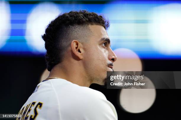 Willy Adames of the Milwaukee Brewers looks on from the dugout