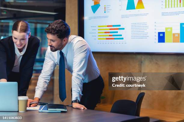 business people working on a laptop computer in a modern office. - financial result stock pictures, royalty-free photos & images