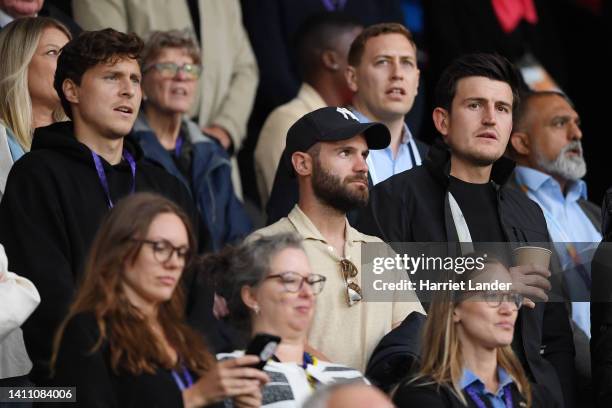Victor Lindelof, Juan Mata and Harry Maguire of Manchester United watch the match from the stands during the UEFA Women's Euro 2022 Semi Final match...