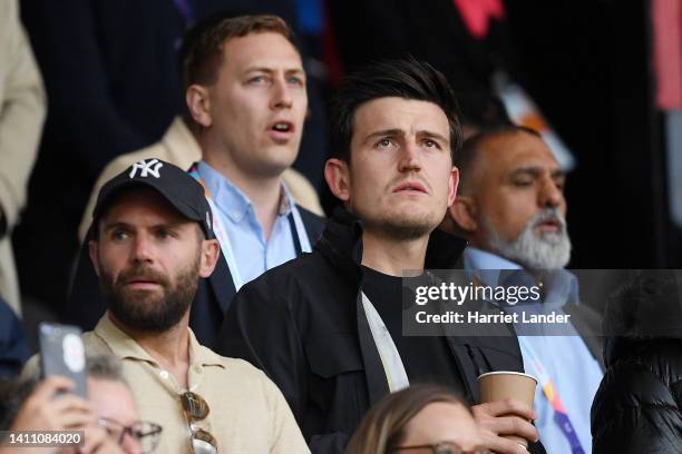 Juan Mata and Harry Maguire of Manchester United watch the match from the stands during the UEFA Women's Euro 2022 Semi Final match between England...