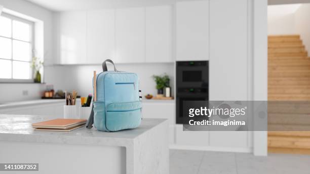 backpack of school child on kitchen counter - kitchen bench top stock pictures, royalty-free photos & images