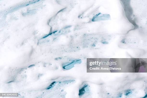 textured foam on blue background - foam material stock pictures, royalty-free photos & images