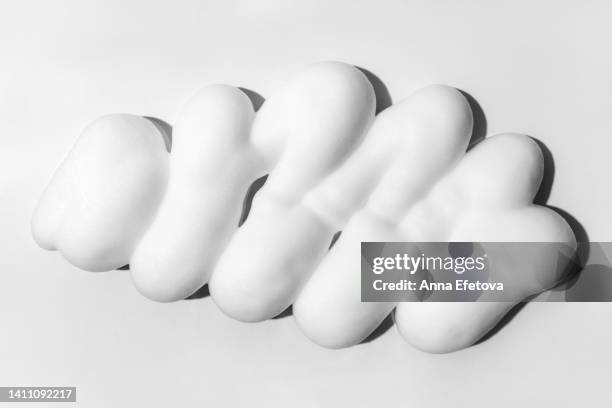 textured foam on grey background - soap stockfoto's en -beelden