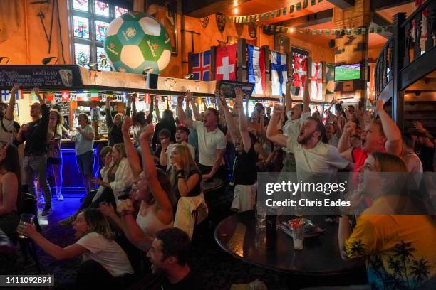 Football fans celebrate England's first goal in the England v Sweden semi-final of the Women's Euros 2022 being played at Bramall Lane in Sheffield,...