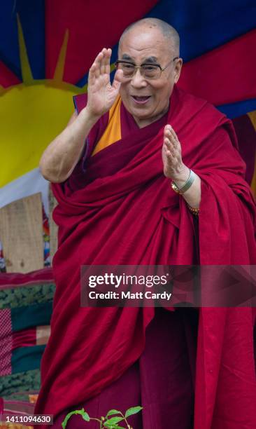 The current Dalai Lama, Tenzin Gyatso, speaks to crowds gathered at the Stone Circle as he appears at the 2015 Glastonbury Festival held at Worthy...