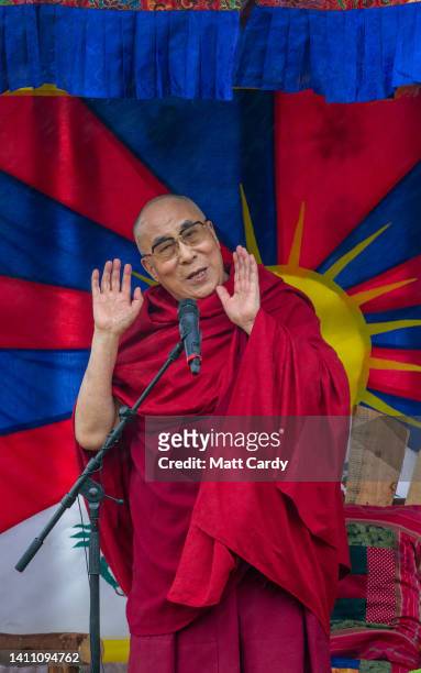 The current Dalai Lama, Tenzin Gyatso, speaks to crowds gathered at the Stone Circle as he appears at the 2015 Glastonbury Festival held at Worthy...