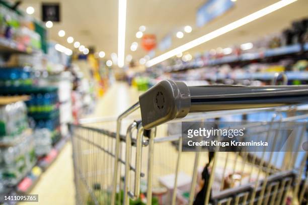 shopping trolley - groceries stock-fotos und bilder