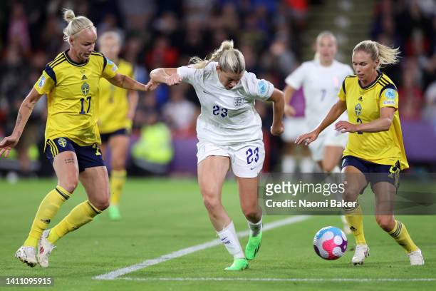 Alessia Russo of England scores their side's third goal whilst under pressure from Caroline Seger and Jonna Andersson of Sweden during the UEFA...