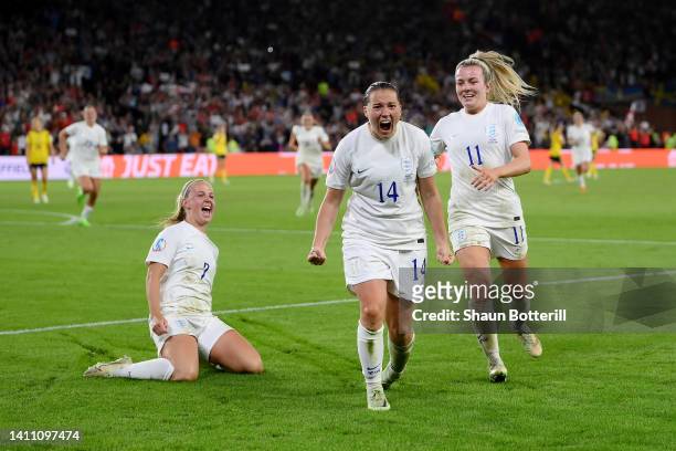 Fran Kirby of England celebrates with teammates Beth Mead and Lauren Hemp after scoring their team's fourth goal during the UEFA Women's Euro 2022...