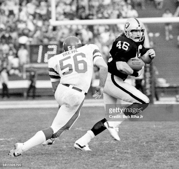 Raiders Todd Christensen is pursued by NY Jets Lance Mehl during AFC Playoff game, January 15, 1983 in Los Angeles, California.