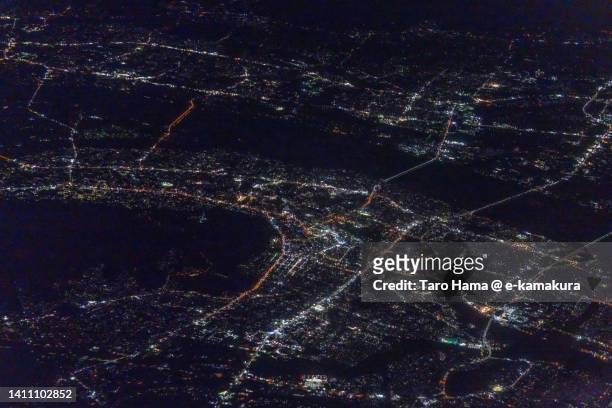 illuminated tokushima city of japan aerial view from airplane - tokushima prefecture stock pictures, royalty-free photos & images