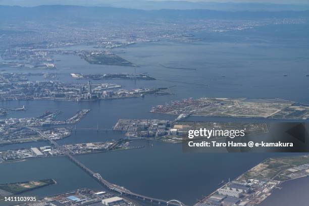 osaka bay in japan aerial view from airplane - kinki stockfoto's en -beelden