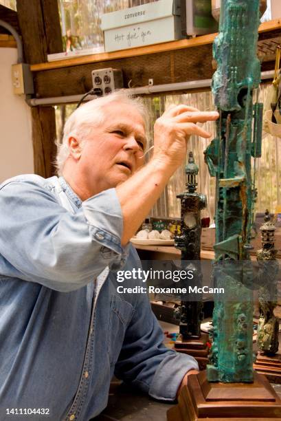Actor and artist Tony Dow works on a sculpture in his studio on June 29, 2014 in Topanga, California.