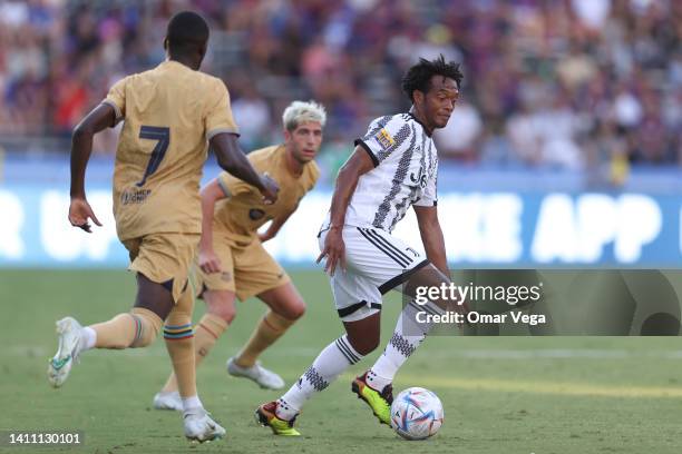 Juan Cuadrado of Juventus FC controls the ball during the preseason friendly match between FC Barcelona and Juventus FC at Cotton Bowl on July 26,...