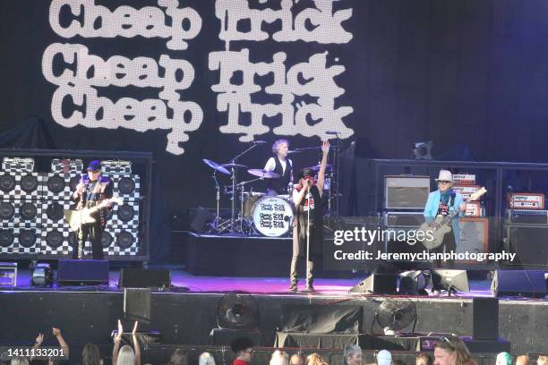 Rick Nielsen, Daxx Nielsen, Robin Zander, and Tom Petersson of Cheap Trick perform at Budweiser Stage on July 26, 2022 in Toronto, Ontario.