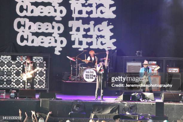 Rick Nielsen, Daxx Nielsen, Robin Zander, and Tom Petersson of Cheap Trick perform at Budweiser Stage on July 26, 2022 in Toronto, Ontario.