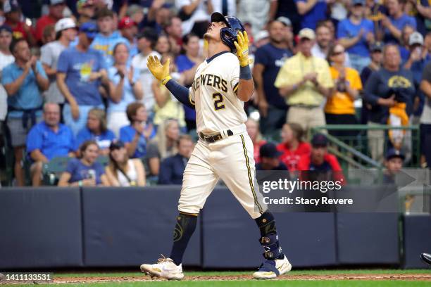 Luis Urias of the Milwaukee Brewers reacts to a home run during the third inning against the Minnesota Twins at American Family Field on July 26,...