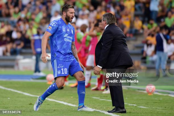 Andre-Pierre Gignac of Tigres celebrates with his coach Miguel Herrera after scoring his team's first goal during the 5th round match between FC...