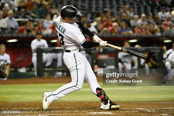 Christian Walker of the Arizona Diamondbacks hits a three-run home run during the third inning of the MLB game against the San Francisco Giants at...