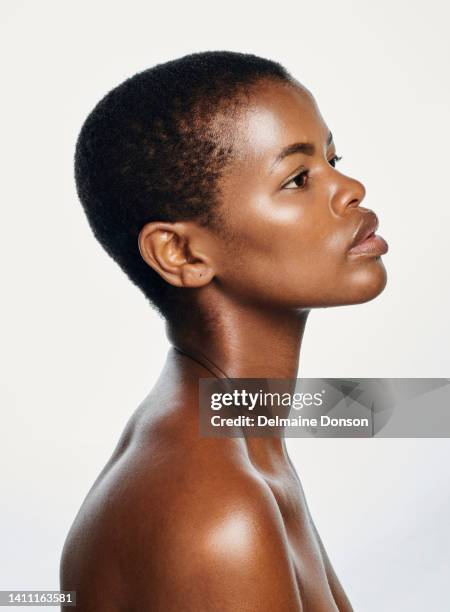 profile of melanin cover model representing proud black beauty, perfect complexion and skin tones. face and headshot of a beautiful, confident and edgy woman with a shaved head and healthy skincare - perfect complexion stock pictures, royalty-free photos & images