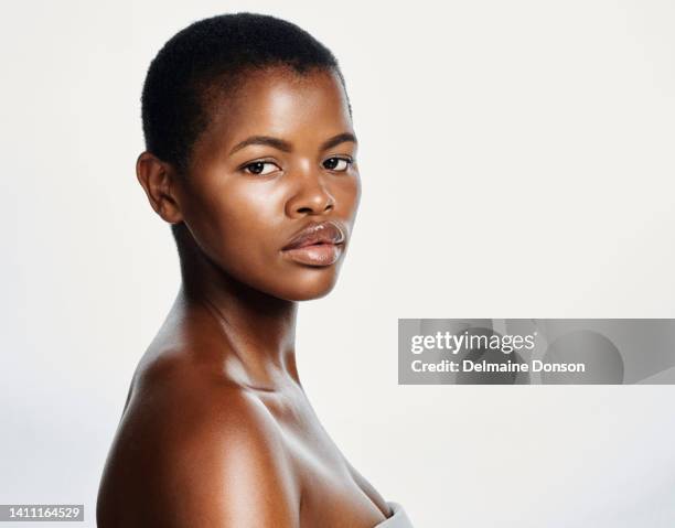 portrait of cover model with attitude representing proud black beauty, perfect complexion and skintone. face, headshot of a beautiful, confident and edgy woman with buzzcut hair and healthy skincare - shaved head profile stock pictures, royalty-free photos & images