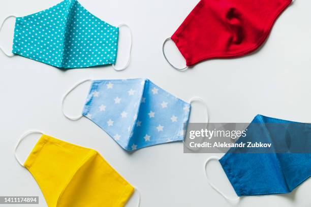 medical reusable face masks that protect against the virus. the concept of air pollution, outbreaks of pneumonia, the coronavirus epidemic, the risk of infection. handmade masks made of fabric on the table. prevention of infection, precautions. - reusable diaper stock pictures, royalty-free photos & images