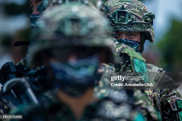 Taiwanese military personnel stand in a line during the Han Kuang military exercise, which simulates China's People's Liberation Army invading the...