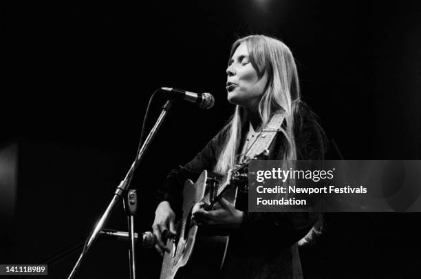 Singer/songwriter Joni Mitchell performs at the Newport Folk Festival in July 1969 in Newport, Rhode Island.