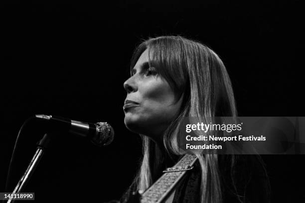 Singer/songwriter Joni Mitchell performs at the Newport Folk Festival in July 1969 in Newport, Rhode Island.