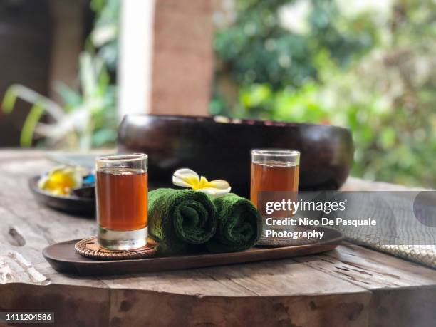 glasses of welcome tea, bali, indonesia - salon de the stock pictures, royalty-free photos & images
