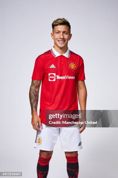 Lisandro Martinez of Manchester United poses after signing for the club at Carrington Training Ground on July 26, 2022 in Manchester, England.