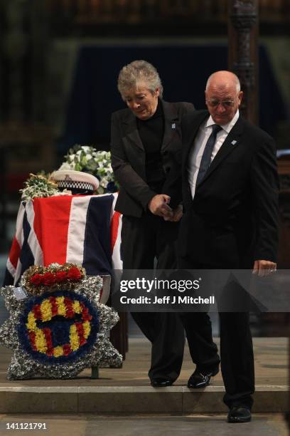 Keith and Marilyn Rathband stand beside the coffin of their son PC David Rathband during a memorial service inside St Nicholas Cathedral on March 10,...