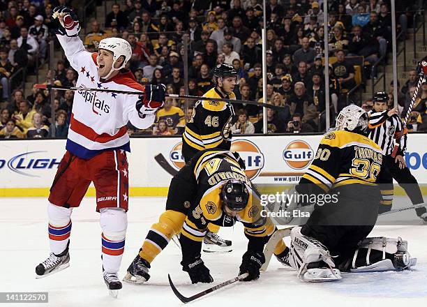 Brooks Laich of the Washington Capitals celebrates his goal in the second period as Adam McQuaid,Tim Thomas and David Krejci of the Boston Bruins...