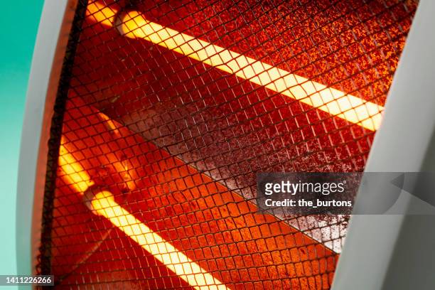 close-up of an electric infrared heater - electric heater stock pictures, royalty-free photos & images