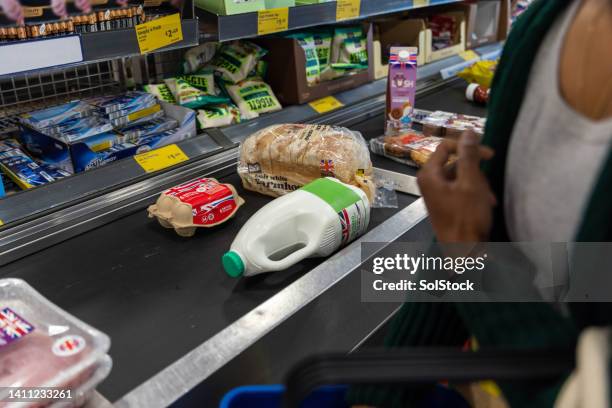 shopping on the conveyor belt - conveyor belt bildbanksfoton och bilder