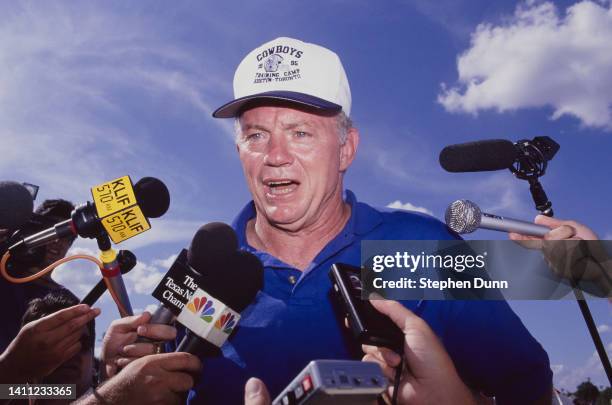 Jerry Jones, owner, president, and general manager of the Dallas Cowboys addresses the press microphones during training camp on 21st July 1995 at...