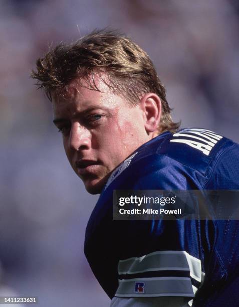 Troy Aikman, Quarterback for the Dallas Cowboys looks on during the National Football Conference East Division game against the Arizona Cardinals on...