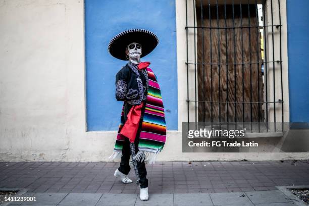 young man dancing and celebrating the day of the dead - la catrina stock pictures, royalty-free photos & images
