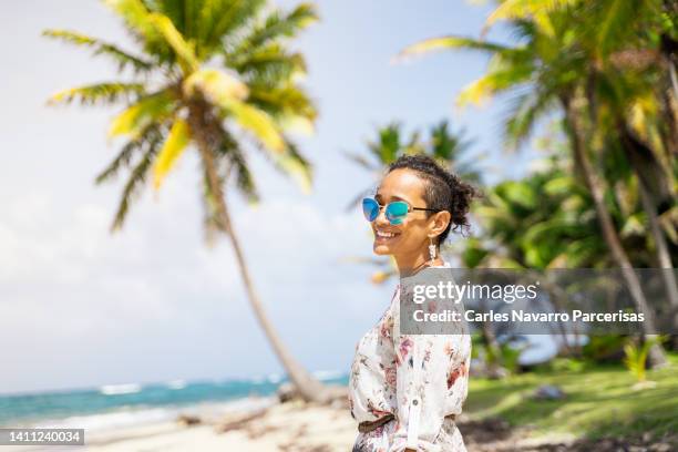 beauty latin woman standing on a tropical beach - caribbean dream stock pictures, royalty-free photos & images