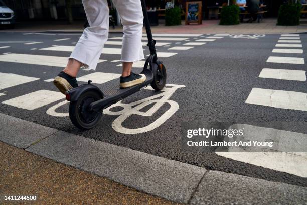 close up of e scooter using a cycle path - scooter stock pictures, royalty-free photos & images