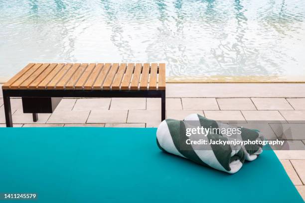 towels on sun loungers by the pool - luxury pool towels stock pictures, royalty-free photos & images