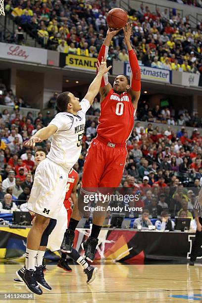 Jared Sullinger of the Ohio State Buckeyes attempts a shot against Jordan Morgan of the Michigan Wolverines during their Semifinal game of the 2012...