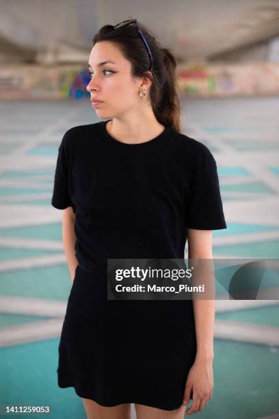 young woman with cool attitude portrait - tshirt mockup stock pictures, royalty-free photos & images