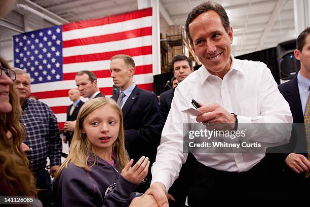 Republican presidential candidate, former U.S. Sen. Rick Santorum greets supporters during a rally March 10, 2012 at Digital Monitoring Products, a...