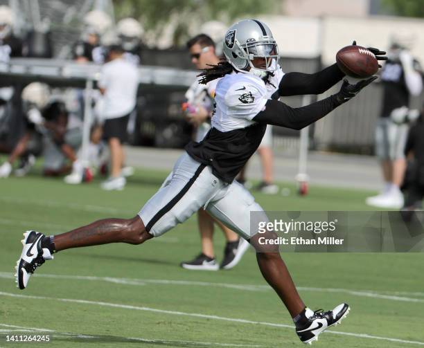 Wide receiver Davante Adams of the Las Vegas Raiders catches a pass during the team's first fully padded practice during training camp at the Las...